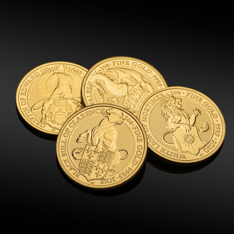 gold round coins on black surface